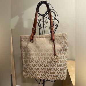 Never used Michael Kors canvas large tote bag with leather straps & gold accents